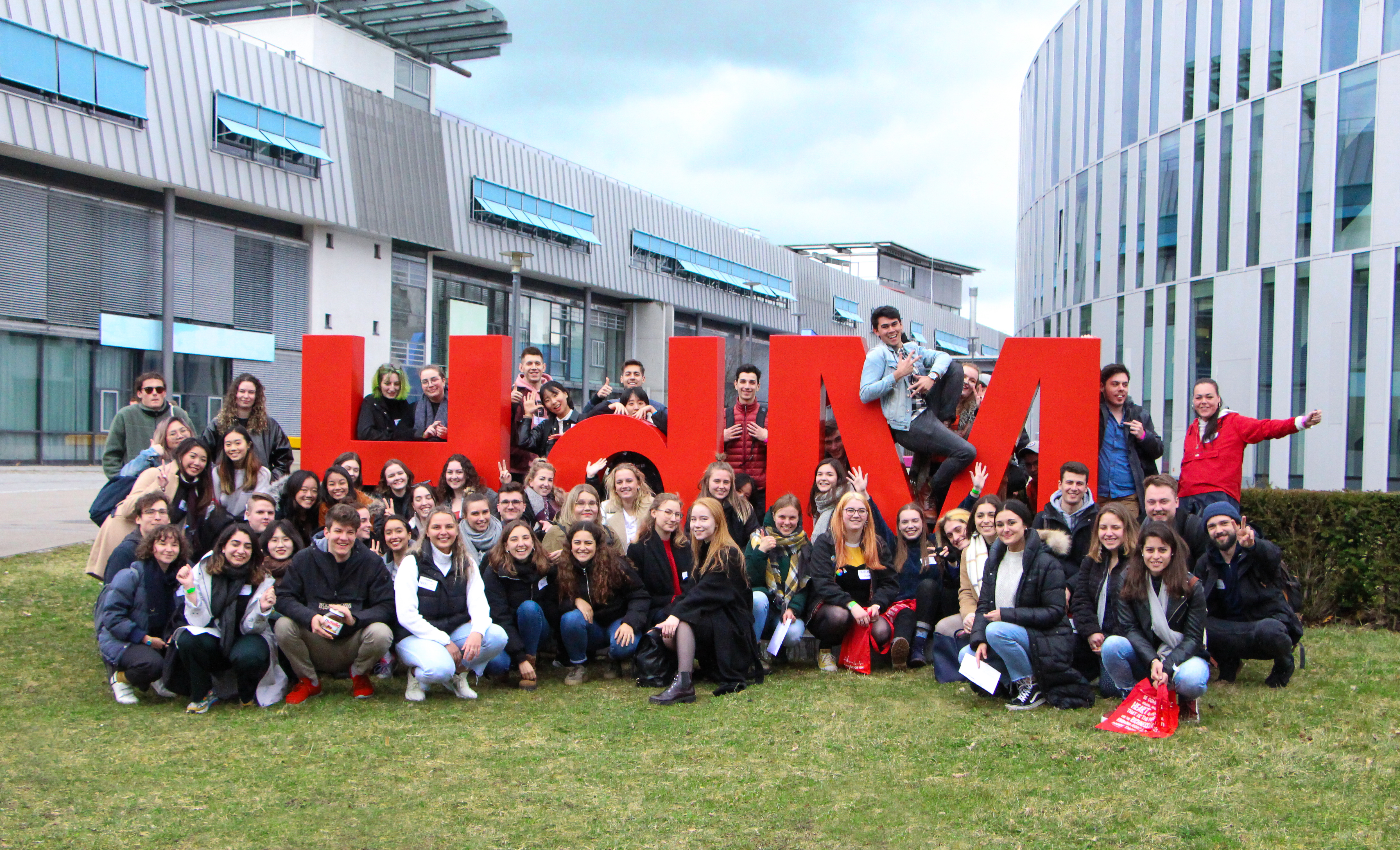 
        The collective of exchange students posed at our host university, before COVID crumbled us away